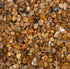 Close-up of small pebbles with various brown and beige colors